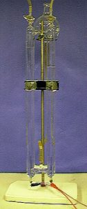 A Hoffman apparatus with indicator changes color based on the polarity of DC current applied.