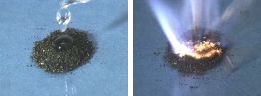 A dropper adds  clear liquid to a dark powder. White flames and yellow embers appear in the dark powder.