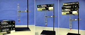 The series of photos trace an experiment where more mass in the form of books are placed on a seated piston made for a syringe on a ring stand.
