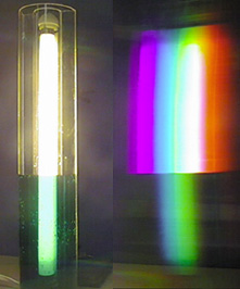 Light shines through a colored liquid in a container