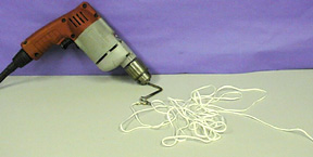 A drill with attached string
