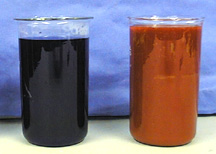 Two beakers, one with a dark liquid and the second with a red precipitate.