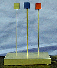 A green cube, a dark blue cube, and a red cube are each attached to a metal rod, with each metal rod connected to a mountaing base.