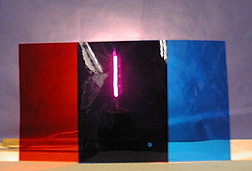 A light shines through red and blue filters.