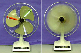 In the first photo, illuminated red, green, and blue sticks are attached to fan blades. In the second photo, the blades spin, and the colors appear as a white blur.