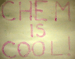 Pink letters appear on heavy, gray white paper