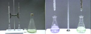 The first photo shows two smaller flasks on a white base next to a beaker and a large, stoppered flask with green liquid. Two clamps each hold a glass buret above a flask. The glass tube on the left contains a gray solid, and the tube on the left contains a different darker substance. The second photo shows smaller flasks and glass tubes, with the flask on the left containing a clear blue liquid and the flask on the right containing a clear yellow liquid.
