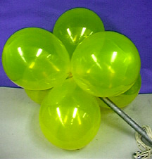 Six yellow balloons attached to a rod with strings