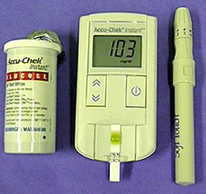 A bottle of meter strips. an instrument for displaying glucose levels, and a sheathed lancet