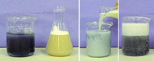 In the first photo, a beaker with dark blue liquid and a flask with white foam and yellow liquid. In the second photo, a pale liquid is poured into a beaker with blue-white liquid. In the third photo, a beaker with white foam in the upper layer and dark liquid in the lower layer.