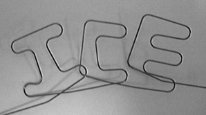 A treated metal wire forms the letters ICE.