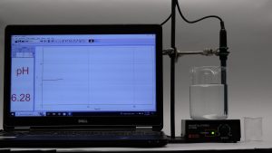 A photo sequence shows a display of a pH reading and a change in the the color of liquid. Top photo 1 of 2