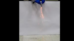 Pyrophoric Carbon: Black particles become fiery sparks when they fall from a test tube. Black solids are seen on the underlayment.